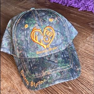 A camo and orange hat